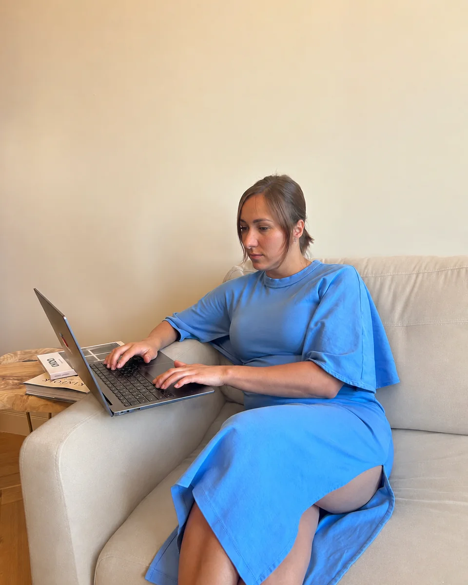 Margo in a calm conversation setting with a laptop